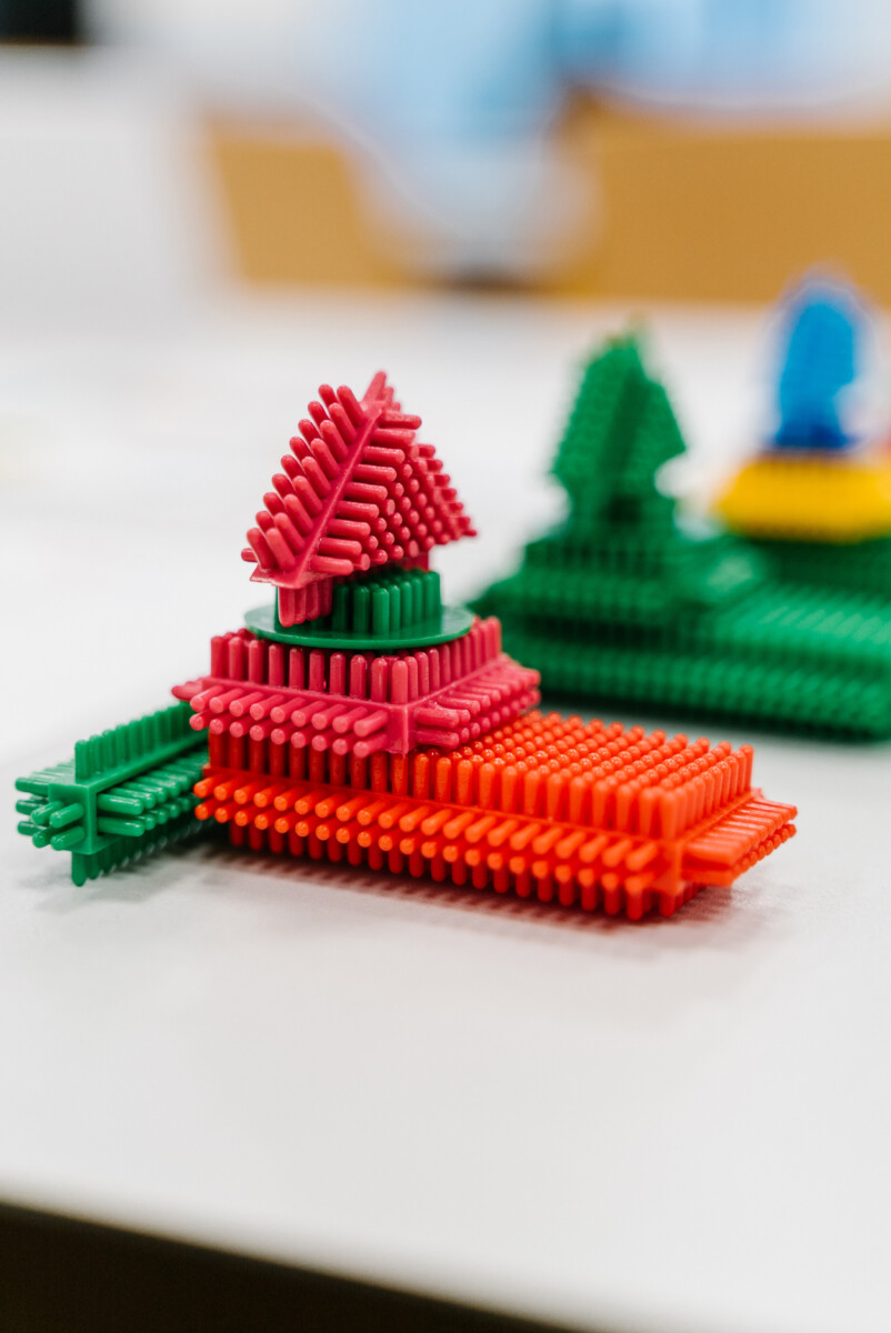 Colorful block structure built during lean management games to support hands-on learning of teamwork, process flow, and Lean principles.